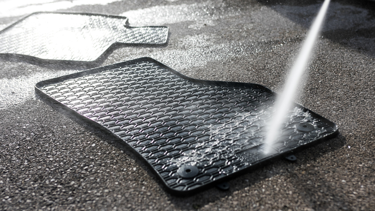 Rinse-Off-The-Mats-With-Water