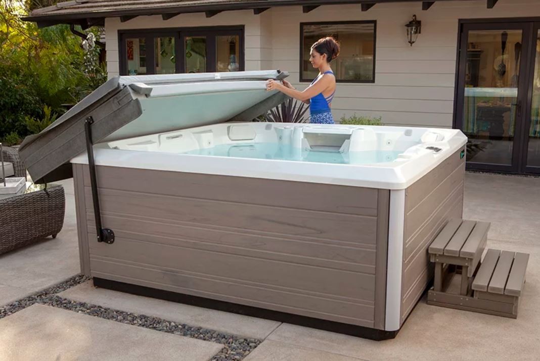 A Girl Standing near a Salt Water Hot Tub