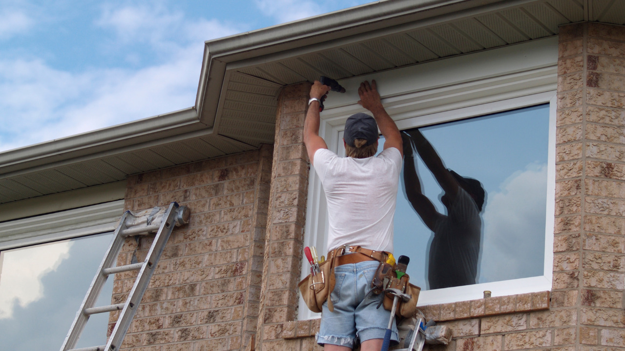 DIY installation of soffit.