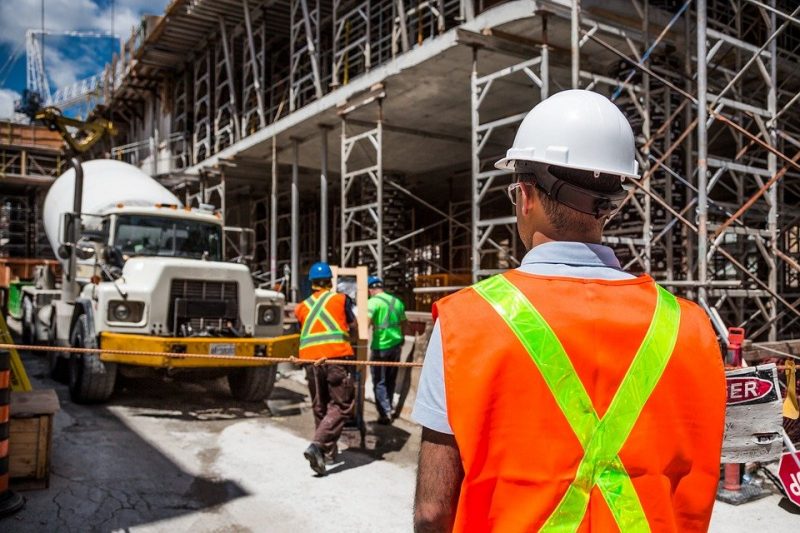 A worker is doing Equipment Inspection at a construction site