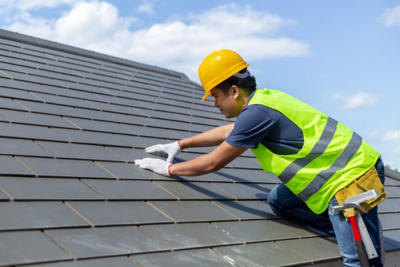  Man replacing a roof 