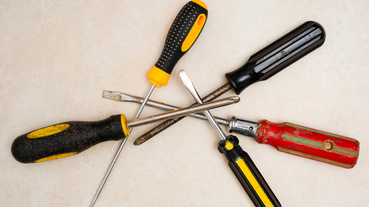 Use A Screwdriver To Remove the Fireplace Cover