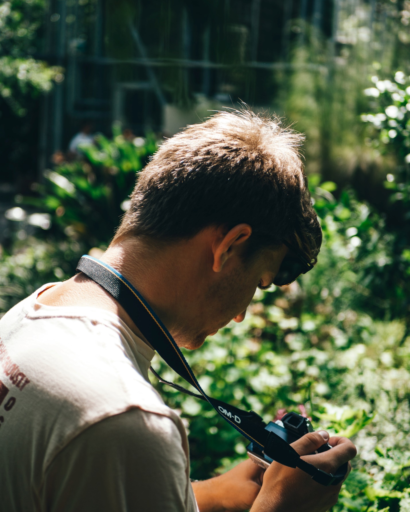 Man Taking Pictures Of Garden Consultation