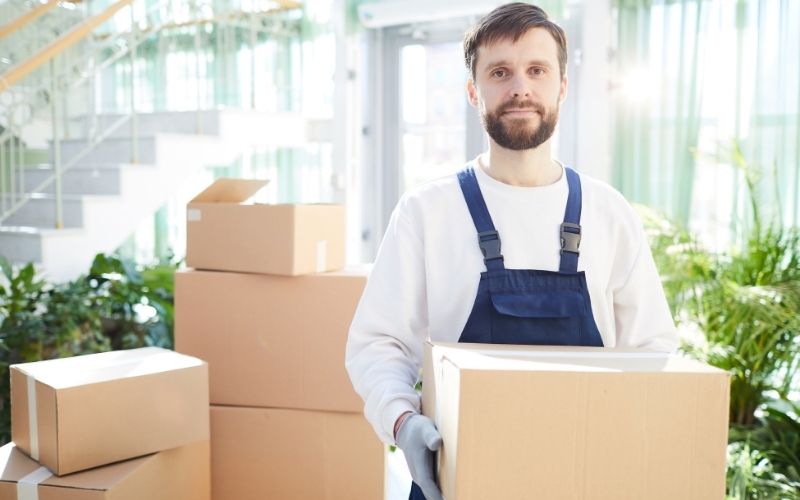 A Man moving his boxes to other pllace 