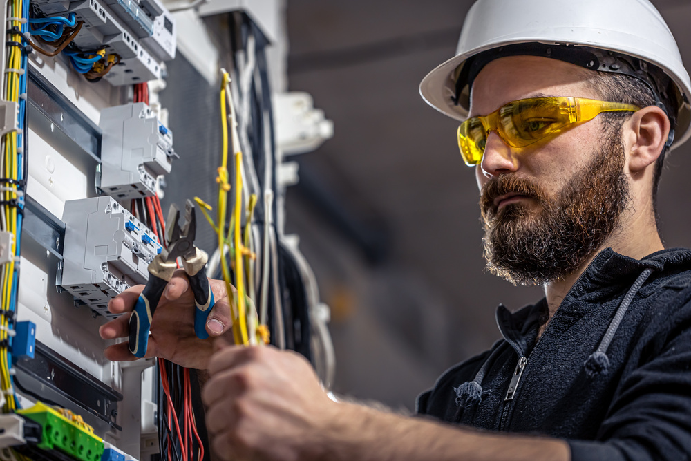  An Electrician repairing circuit after a spark