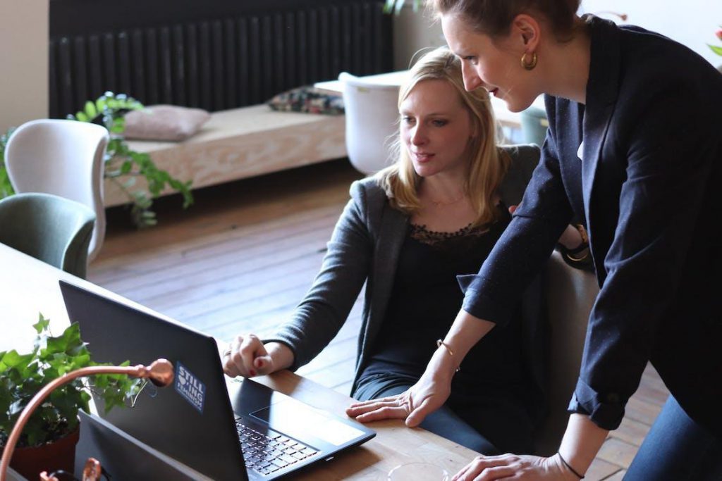 Free Two Women Using on Black Laptop Computer Stock Photo