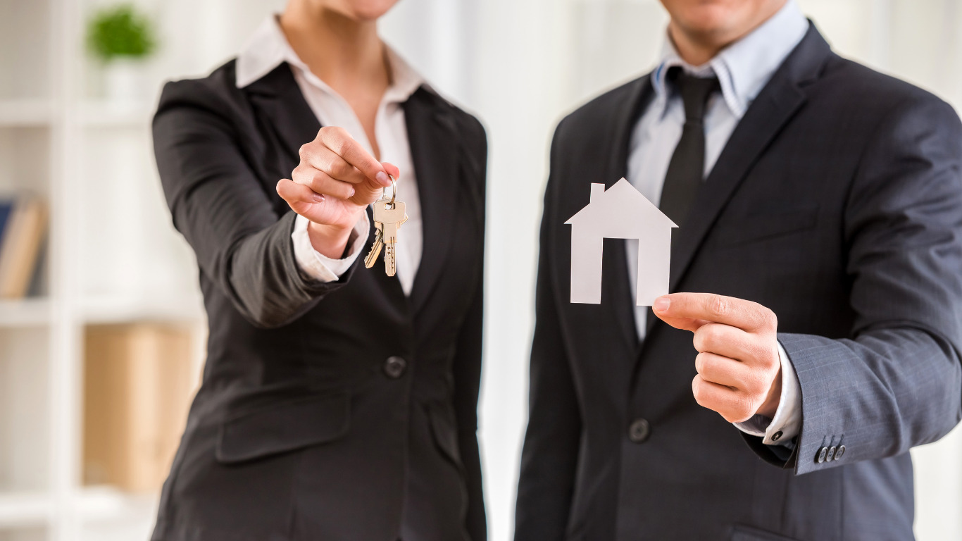 a girl handing keys