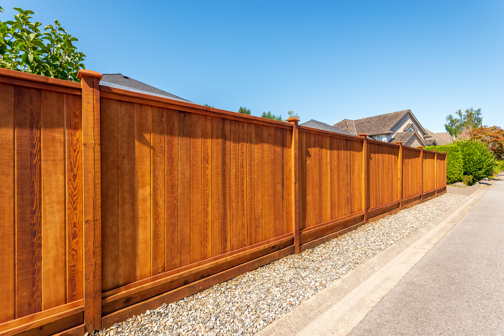 Fence built from wood. Outdoor landscape. Security and privacy c