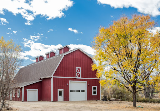 An old red barn in an autumn landscape
