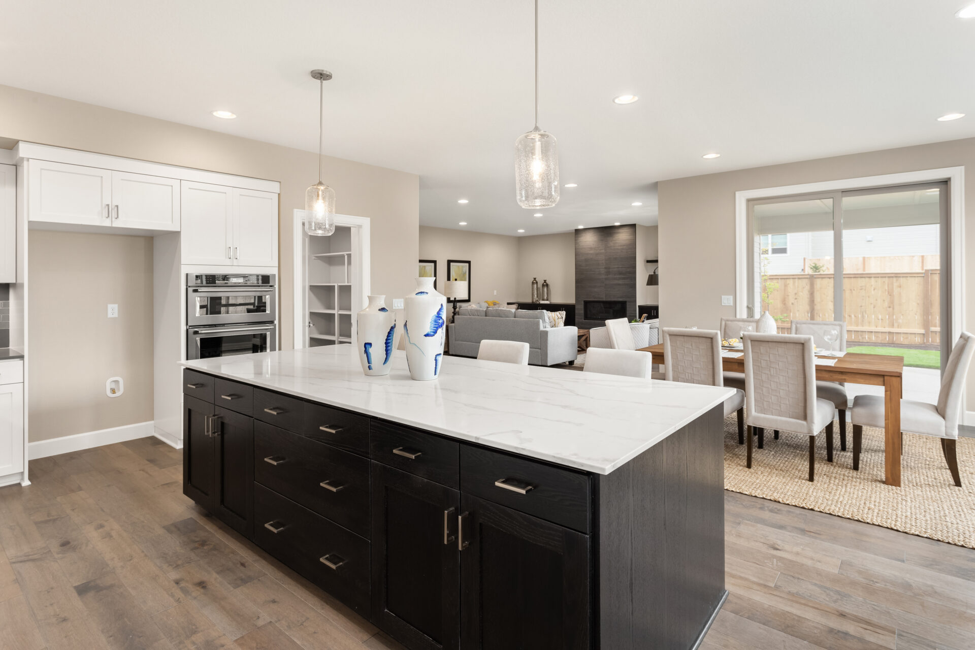 Kitchen and living room interior in new luxury home with open co