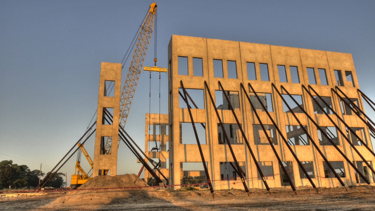 A building being put on ground using tilt-wall technique